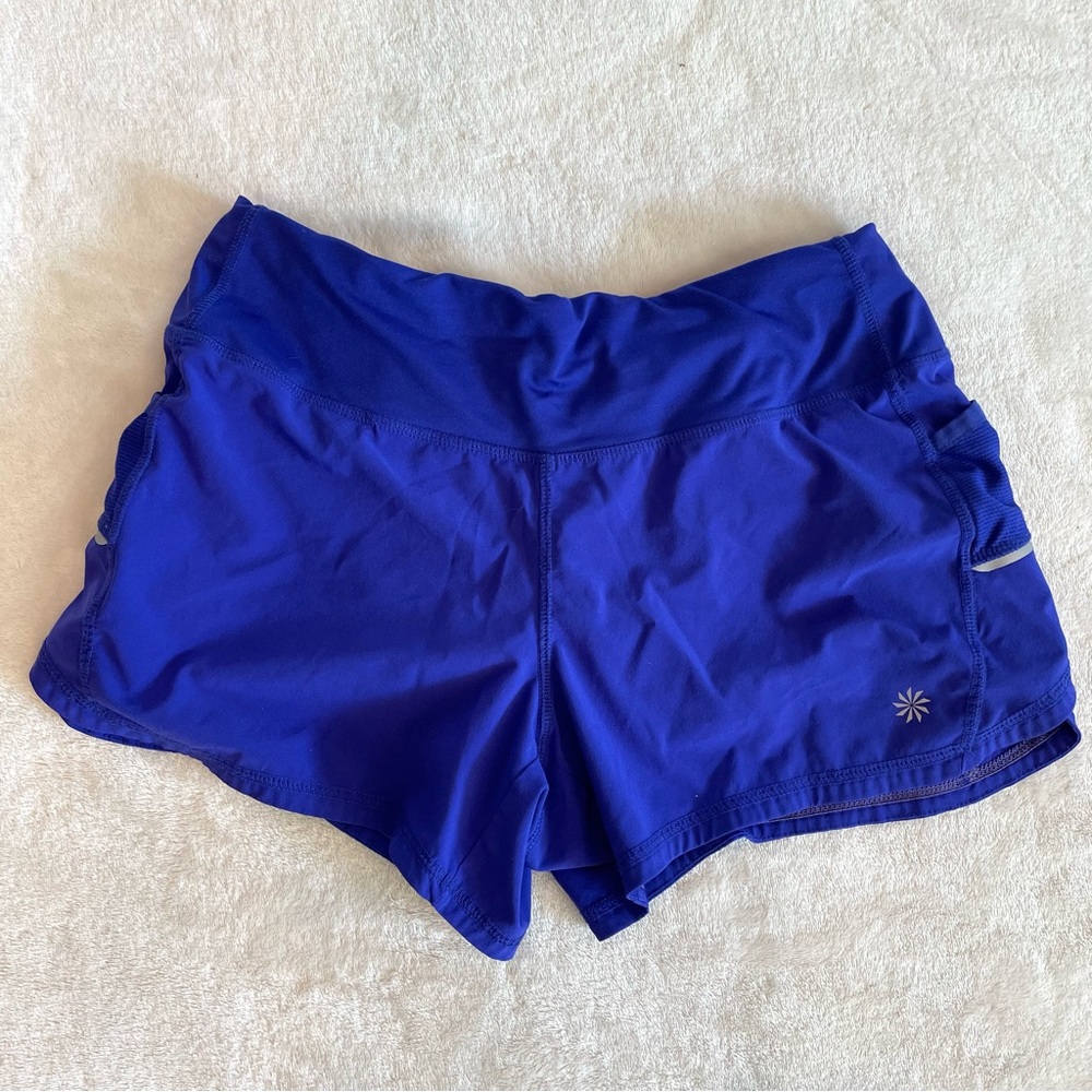 2 pairs Athelta shorts. 1 black, 1 purple